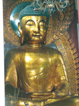 This is a seated Buddha statue at the Temple of The Six Banyan Trees, in Guangzhou, China.の写真素材