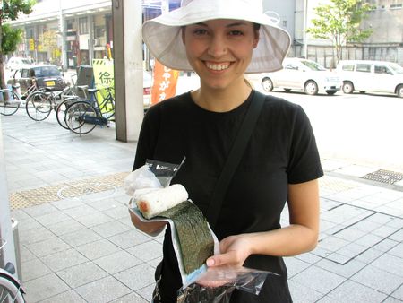 a young woman trying Sushi in Japan.の写真素材