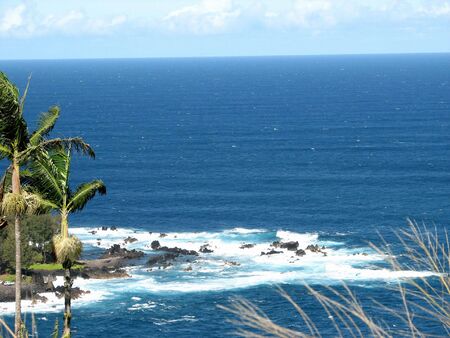 Rock and coral breakers that line the Hawaiian beaches.の写真素材