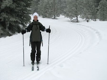 A beautiful young woman cross country skiing in the California Mountains.  Taken on Mt. Shasta, California.の写真素材