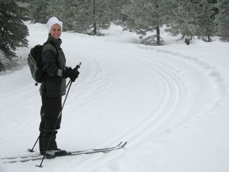 A beautiful young woman cross country skiing in the California Mountains.  Taken on Mt. Shasta, California.の写真素材
