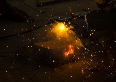 sparks while welder working at construction site, closeup of photoの写真素材