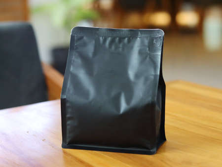 Photo of standing pouch coffee packaging on the cafe table. suitable for mock up label stickers, coffee variant packaging stickers or etc.の写真素材