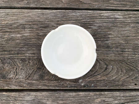 Top view ashtray on wood textured tableの写真素材