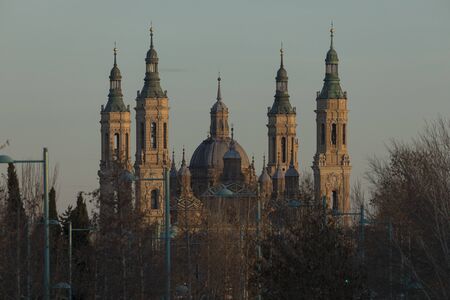 Zaragoza, Spain - February 2, 2020: Cathedral-Basilica of Our Lady of the Pillar in a winter afternoon, seen next to the Ebro river from the José Atarés Avenueのeditorial素材
