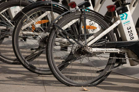 Madrid, Spain - February 25, 2020: Dirty and broken electric bicycles from the public urban transport service BiciMAD from the EMT public company, parked in front of Atocha train station in Madridのeditorial素材