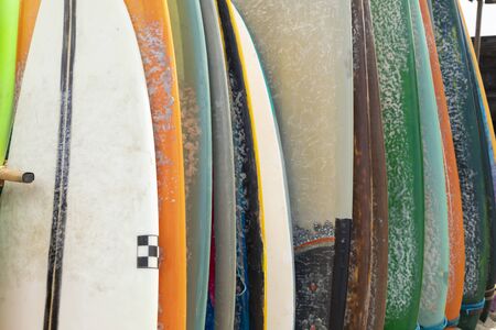 Texture of surfboards, covered in paraffin, stored waiting for a surfer on the beach of Canggu, south of Bali, Indonesia, on a hot August day.の写真素材