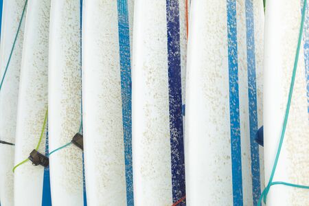 Texture of surfboards, covered in paraffin, stored waiting for a surfer on the beach of Canggu, south of Bali, Indonesia, on a hot August day.の写真素材