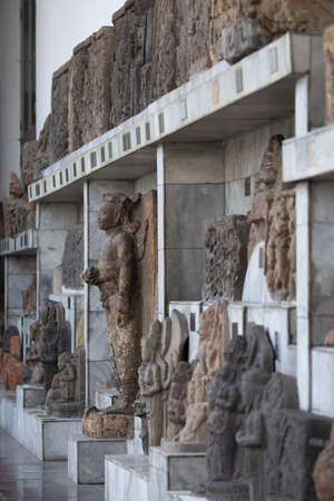 Jakarta, Indonesia - July 14, 2019: Exterior gallery with various stone sculptures and reliefs from...