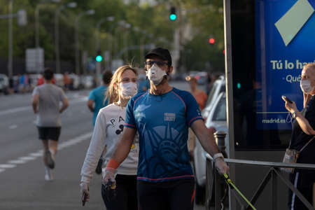 Madrid, Spain - May 02, 2020: People walking and doing individual sport in a massive way in central Madrid, during the first day of phase zero of de-escalation during the COVID-19 pandemic.のeditorial素材