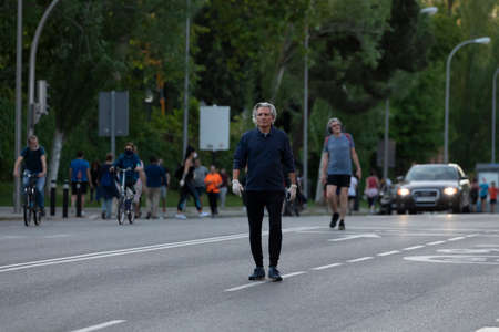 Madrid, Spain - May 02, 2020: People walking and doing individual sport in a massive way in central Madrid, during the first day of phase zero of de-escalation during the COVID-19 pandemic.のeditorial素材
