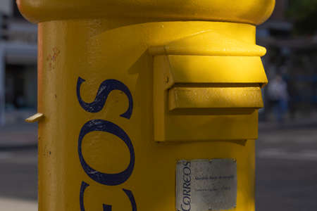 Madrid, Spain - May 19, 2020: Close-up of a postal mailbox of the state postal service on Ibiza street, in the Retiro district.のeditorial素材