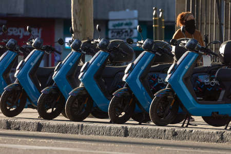 Madrid, Spain - May 19, 2020: Electric motorcycle of the shared system transport service from the Movo company, parked in O'donell street.のeditorial素材