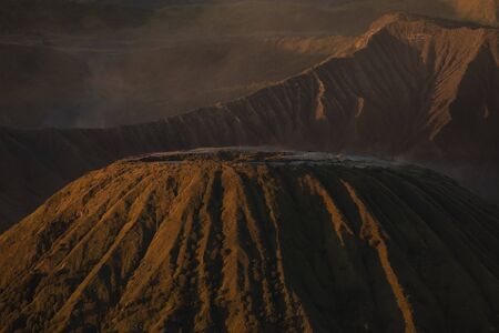 Landscapes and sunrise details at the Batok mountain, and the Tengger massif, in East Java,...