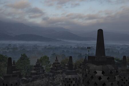 Details of a dark and silent sunrise between the stupas of the ancient Borobudur Buddhist temple, near Yogyakarta and Magelang, in the province of Central Java, Indonesia.の写真素材