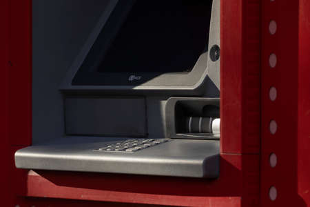 Madrid, Spain - May 18, 2020: An outdoor ATM machine, at the entrance to the bank office of, Santander, in the Retiro district.のeditorial素材