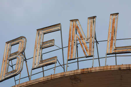 Madrid, Spain - May 19, 2020: The old rusty sign of the Benlliure cinemas, located on the roof of a building, on Alcala street, in the Retiro district.のeditorial素材