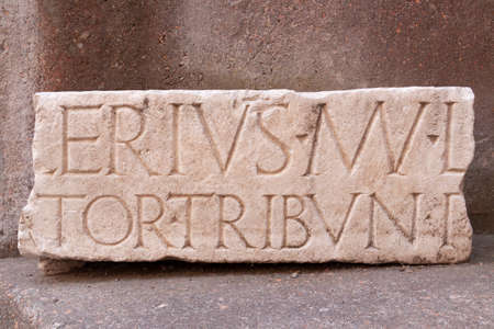 Rome, Italy - June 28, 2010: Ancient Latin inscription, carved from a heavy block of white marble,...
