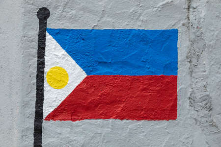 Childish style drawing, of the flag of Philippines, painted on a wall.の写真素材