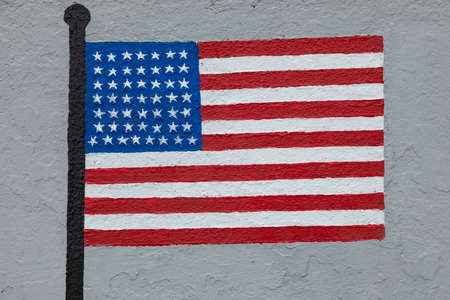 Childish style drawing, of the flag of the United States of America, painted on a wall.の写真素材