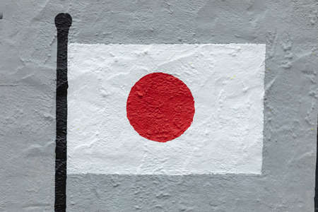 Childish style drawing, of the flag of Japan, painted on a wall.の写真素材