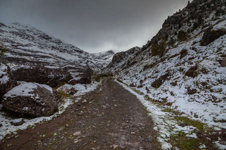 Snowy mountains in the Aragonese Pyrenees. Path from Guarrinza pastures to Aguas Tuertas valley, Hecho and Anso, Huesca, Spain.の写真素材