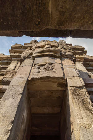 Huge carved stone face, in one of the shrines of the Prambanan ancient Hindu temple complex, Rara Jonggrang, in the Special, Yogyakarta region, Indonesia.の写真素材