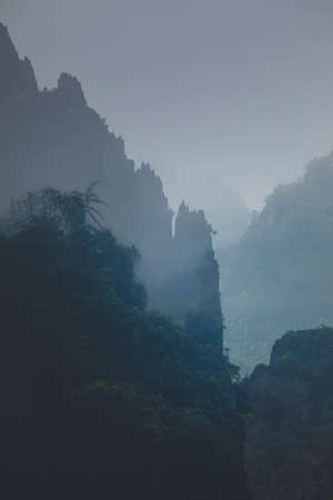 Fantastic foggy fictional landscape, digitally created with landscape photos from Southeast Asia,...