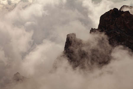 Impressive landscape of clouds and volcanic mountains from the top of the Roque de los Muchachos...