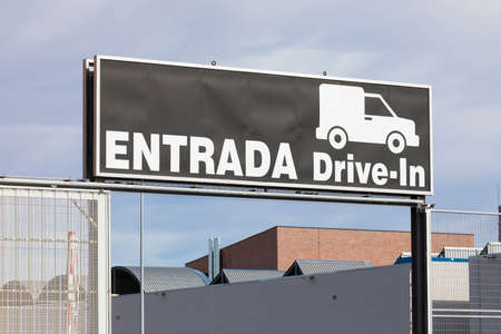 Zaragoza, Spain - December 03, 2020: Drive-in entrance sign at a giant warehouse, of the Brico Depot company, which sells DIY and construction materials, on the outskirts of Zaragoza city, near Utebo.のeditorial素材