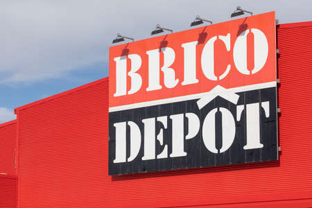 Zaragoza, Spain - December 03, 2020: Logo of the Brico Depot company, which sells DIY materials, in a giant warehouse, on the outskirts of Zaragoza city, near Utebo.のeditorial素材