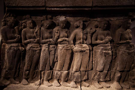 Bangkok, Thailand - March 25, 2018: Stone carved relief of mythological figures and scenes of Buddha, in one of the exhibition halls of the Siwamok Phiman Hall building in the Bangkok National Museum.のeditorial素材
