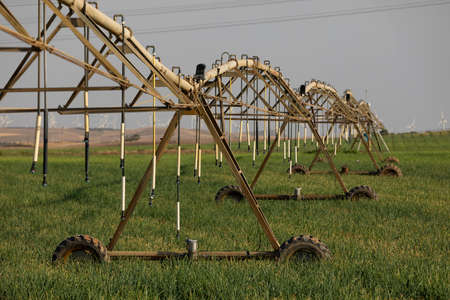 Gallur, Spain - July 27, 2020: Irrigation pivot, with water or chemigation, fed by pipeline, example of agricultural machinery and agro-industrial infrastructures in crop fields in Aragon.のeditorial素材
