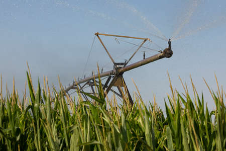 Gallur, Spain - July 27, 2020: Irrigation pivot, with water or chemigation, fed by pipeline, example of agricultural machinery and agro-industrial infrastructures in crop fields in Aragon.のeditorial素材