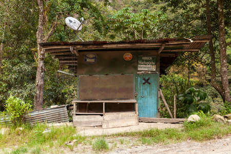 Aguas Calientes, Peru - April 07, 2014: Old cabin, abandoned food stall, near the Urubamba or Vilcanota river, and the town of Aguas Calientes, surrounded by Amazon cloud forest, Peru.のeditorial素材