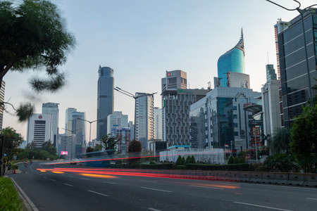 Jakarta, Indonesia - Oct 20, 2019: Skyline of skyscrapers in Jakarta and bus and motorcycle traffic on Jend Sudirman streetのeditorial素材