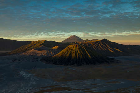Bromo active volcano landscape at sunrise, behind the Tengger massif, seen from the King Kong Hill...