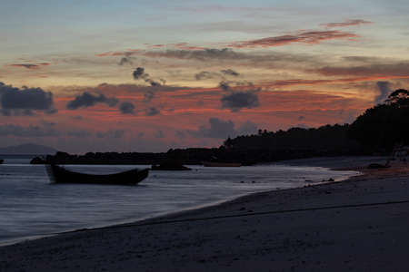 Pasir Putih Beach at sunset, one of the tropical beaches facing the Indian Ocean, south of the island of Pulau We, Aceh, Sumatra, Indonesiaの写真素材