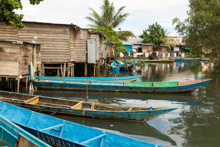 Waisai, Indonesia - Oct 17, 2019: Boats moored in one of the water channels running through the town of Waisai, Raja Ampat Islands, Indonesiaのeditorial素材