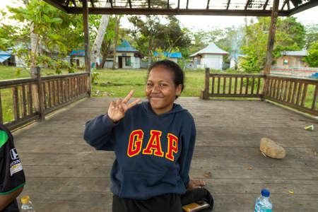 Waisai, Indonesia - Oct 16, 2019: A young Melanesian girl, a local resident in Waisai, West Papua, greets animatedly after chatting with meのeditorial素材