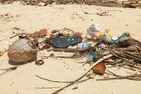 Besir area, Indonesia - Oct 10, 2019: Plastics, garbage and bottles washed up, on a beach on the tropical island of Gam, Raja Ampat, Indonesiaのeditorial素材