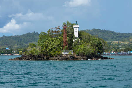 An old welcome monument for travelers and boats, on one of the characteristic islets in the bay of...