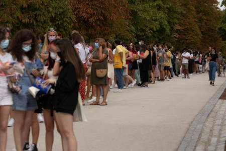 Madrid, Spain - Sep 11, 2021: A very long queue, people waiting to access a book signing at the 80th Madrid book fairのeditorial素材