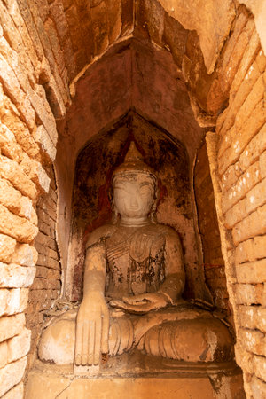 Ancient depict of Buddha sitting inside one of the stupas, in Nyaung Ohak, near Shwe Indein Pagoda, Shan State, Myanmar, Burmaの写真素材
