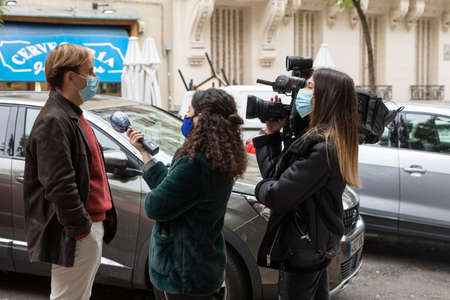 Madrid, Spain - Oct 28, 2020: Two female journalists from the channel TRECE TV, group COPE,...