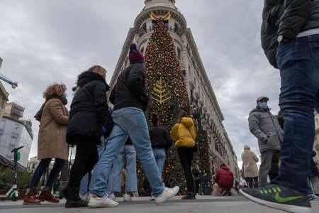 Madrid, Spain - Dec 27, 2020: Four Seasons Hotel Madrid, decorated with a huge Christmas tree full of balls, on its main facade, in Alcala streetのeditorial素材