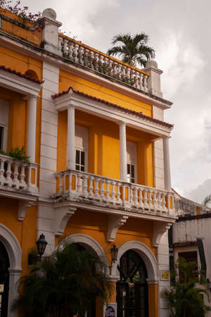 Cartagena de Indias, Colombia - Nov 23, 2010: The last lights of the afternoon, already dim, illuminate one of the colonial buildings of the San Pedro Claver square, in the historic center of the cityのeditorial素材