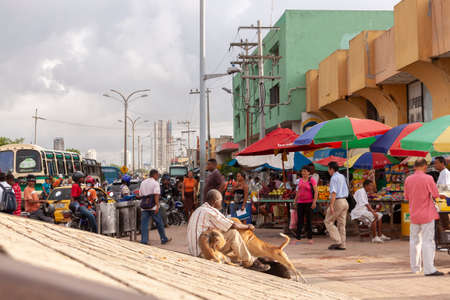 Cartagena de Indias, Colombia - Nov 23, 2010: Streets, traffic, stalls selling food and things, and bustle of people around Avenida Venezuela, on the outskirts of the historic center of the cityのeditorial素材