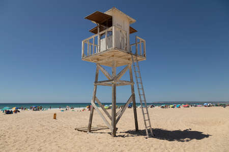Zahara de los Atunes, Spain - Sept 04, 2021: Old watchtower, belonging to the public lifeguard service, on the beach, Cadiz provinceのeditorial素材