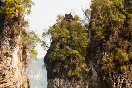 Khao Sam Kloe, a dream place among karsts, rainforest-covered mountains at Cheow Lan Lake, Khao Sok National Park, Thailandの写真素材
